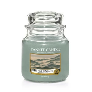 Свеча средняя в стеклянной банке "Туманные горы" Misty Mountains 411 гр 65-90 часов YANKEE CANDLE  268021 Голубой