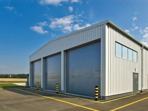 WISNIOWSKI Вертикальная раздвижная дверь Portoni sezionali industriali